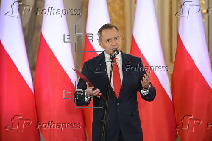 Polish President-elect Karol Nawrocki receives the winning certificate
