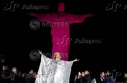 Models present creations by Alessa at the Christ the Redeemer statue to mark the launch of Rio Fashion Show, in Rio de Janeiro
