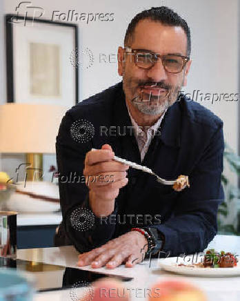 Palestinian-British chef Tamimi poses for a portrait during an interview with Reuters at his home in London