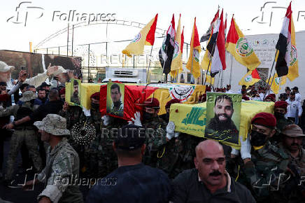 Funeral of Haider al-Moussawi and head of the security unit in the Shi'ite armed group Kataib Sayyid al-Shuhada, and senior Hezbollah figure Abu Ali Khalil, in Baghdad