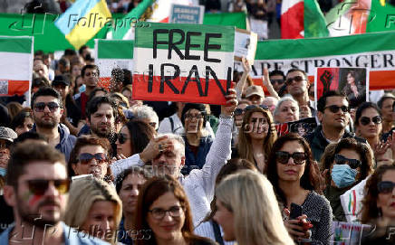 People protest following the death of Mahsa Amini, in London