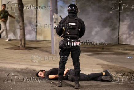 Serbia's police intervene to end standoff between ruling party supporters and anti-government protesters in Belgrade