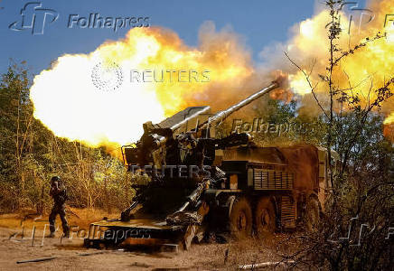 A Ukrainian serviceman fires a self-propelled howitzer towards Russian troops in Zaporizhzhia region