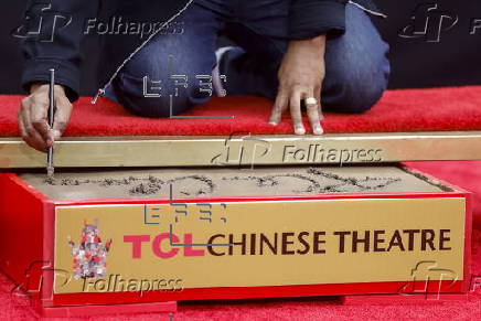 Ice Cube is honored at handprint and footprint ceremony in Los Angeles