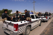 Syrian security forces deployed in the village of Al-Soura al-Kubra