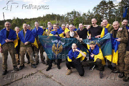 Ukrainian POWs are seen after a swap at an unknown location in Ukraine