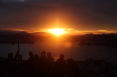 People gather to take photos during sunrise from the Dona Marta lookout point in Rio de Janeiro
