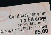 Photo illustration of EuroMillions lottery ticket