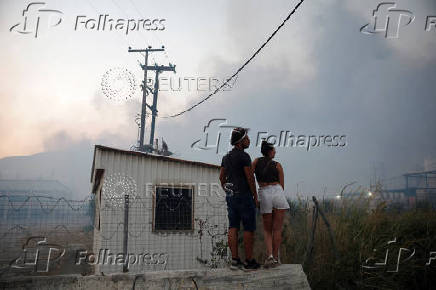 Wildfire burns houses, factories, forcing evacuations near Patras