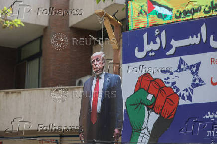 Cut-out of U.S. President Trump being hanged is displayed in Palestine Square in Tehran