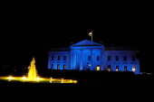 FILE PHOTO: The North Portico of the White House is illuminated in blue for Autism Awareness Day, in Washington