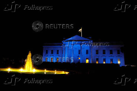 FILE PHOTO: The North Portico of the White House is illuminated in blue for Autism Awareness Day, in Washington