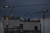 Workers work at a construction site of a high rise building in Jakarta