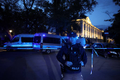 Polish police secure an earea at the Warsaw University after an attack with an axe