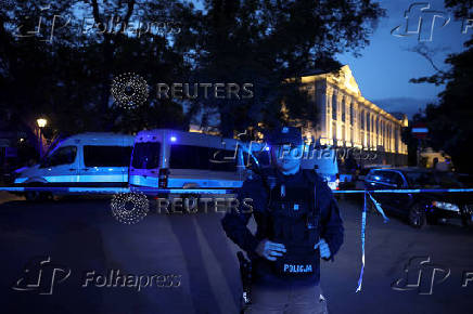 Polish police secure an earea at the Warsaw University after an attack with an axe