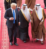 FILE PHOTO: Saudi Arabia's King Salman bin Abdulaziz Al Saud and U.S. President Donald Trump walk during a reception ceremony in Riyadh