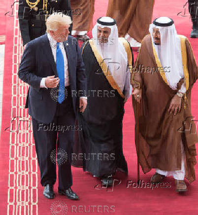 FILE PHOTO: Saudi Arabia's King Salman bin Abdulaziz Al Saud and U.S. President Donald Trump walk during a reception ceremony in Riyadh