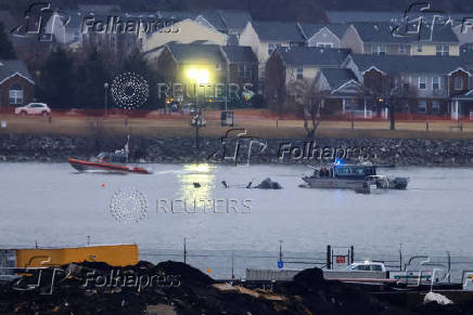 FILE PHOTO: Aftermath of American Eagle flight 5342 crash in the Potomac River near Ronald Reagan Washington National Airport