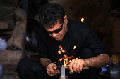 Blacksmiths sharpen blades for flagellation ahead of Ashura in Peshawar