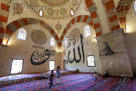 Children run before the Friday prayers at the Old Mosque in Edirne