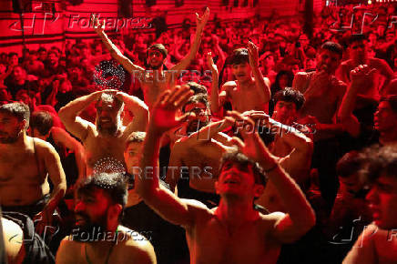 Shi'ite Muslims beat their chests during a religious ritual marking Ashura, the holiest day on the Shi'ite Muslim calendar, in Baghdad