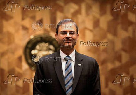 FILE PHOTO: FILE PHOTO: FILE PHOTO: Reserve Bank of India (RBI) Governor Sanjay Malhotra poses for a picture as he returns after a press conference in Mumbai