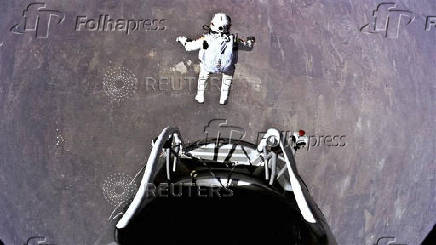 Pilot Felix Baumgartner of Austria jumps out of his capsule during the final manned flight for Red Bull Stratos in Roswell