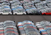 Honda vehicles are lined up at a vehicle storage yard at an industrial port in Yokohama