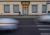 FILE PHOTO: Traffic moves past a closed Gucci store in Moscow