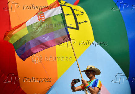 FILE PHOTO: A person attends the Budapest Pride march in 2022