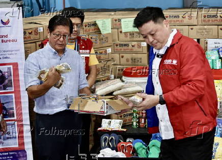 President Ferdinand Marcos visits a relief goods warehouse in Manila as Tropical Storm 'Crising apporaches
