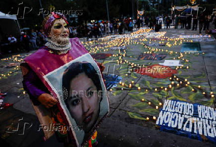 Family members and friends of missing persons participate in a candlelight vigil, in Mexico City