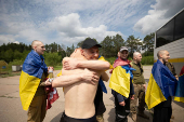 Ukrainian POWs are seen after a swap at an unknown location in Ukraine