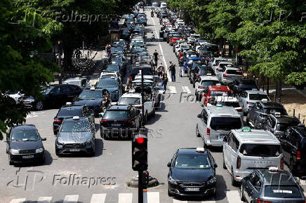 French taxi drivers protest near the Bercy Economy and Finance Ministry in Paris