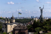 Ukrainian national flag flies at half-mast near the Ukrainian Motherland Monument after Tuesday?s deadly Russian missile strike in Kyiv