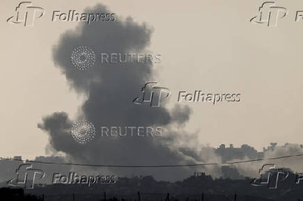 Smoke rises from Gaza after an explosion