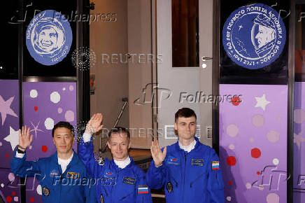 ISS crew departs the hotel for a pre-flight preparation, in Baikonur Cosmodrome
