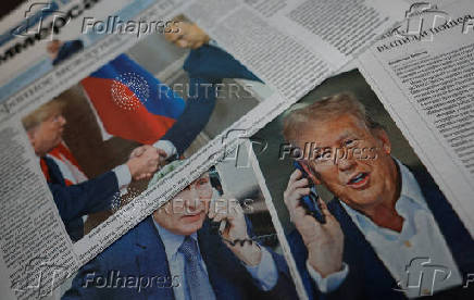 FILE PHOTO: View of newspaper covers dedicated to Putin-Trump phone call at newsstand in Moscow