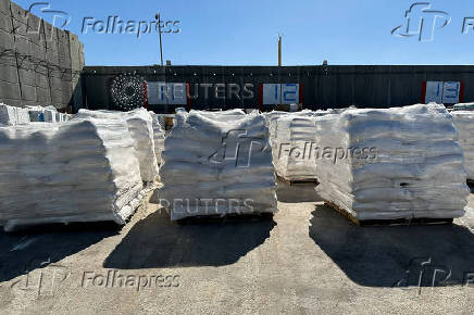 Supplies wait to be loaded on trucks to go into the Gaza Strip, at the Kerem Shalom crossing between Israel and Gaza