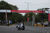A banner for the upcoming 72nd Miss World pageant is displayed at a street in Hyderabad