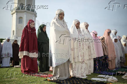 Indonesian Muslim women attend mass prayers at Baiturrahman mosque during Eid al-Adha, in Banda Aceh