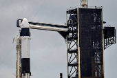 A Dragon crew capsule sits atop a Falcon 9 rocket at Launch Complex 39-A after the Axiom-4 crewed mission to the International Space Station was delayed by technical issues