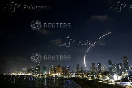 Missiles launched from Iran are intercepted as seen from Tel Aviv