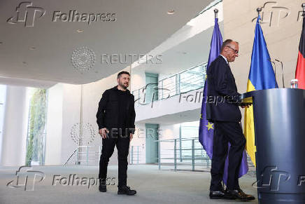 German Chancellor Merz speaks to the media, in Berlin