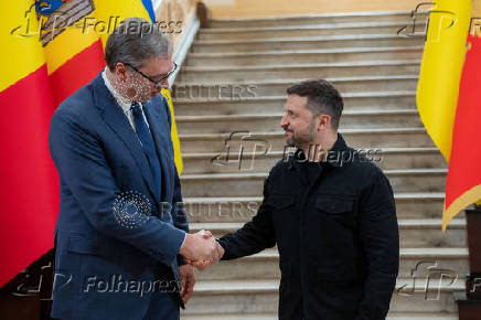 Ukraine's President Zelenskiy and Serbian President Vucic shake hands during the Fourth Ukraine?Southeast Europe Summit in Odesa