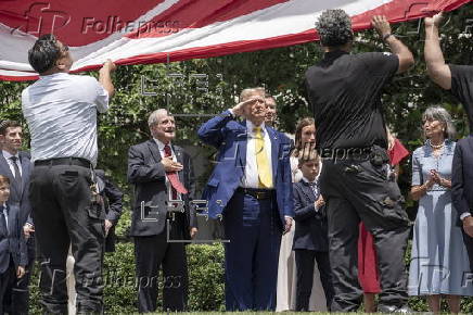 A new flagpole is installed on the South Lawn of the White House