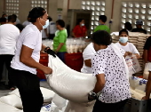 President Ferdinand Marcos visits a relief goods warehouse in Manila as Tropical Storm 'Crising apporaches
