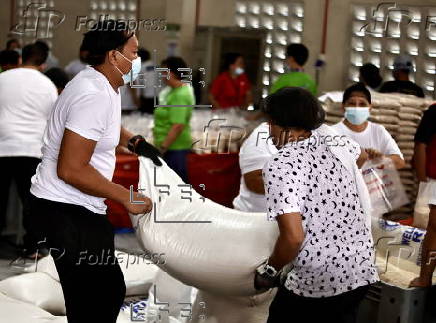 President Ferdinand Marcos visits a relief goods warehouse in Manila as Tropical Storm 'Crising apporaches
