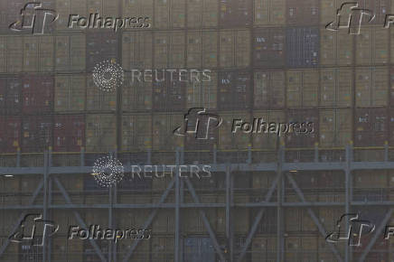 Container ships sail on the Savannah River in Savannah, Georgia, US