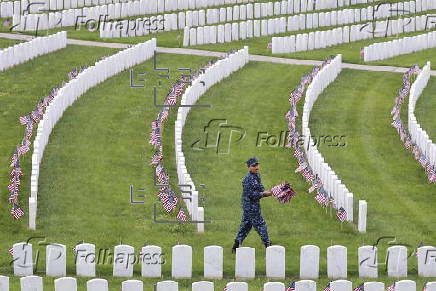 Flags placed on military veteran graves for Memorial Day in Brooklyn